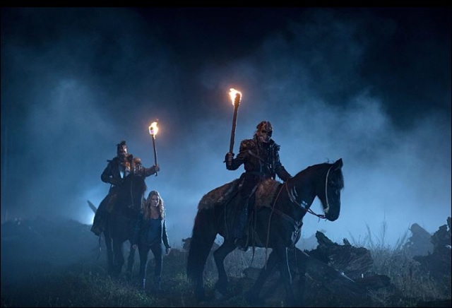 Severin Pederson, back left, in a scene from the TV series "The 100".